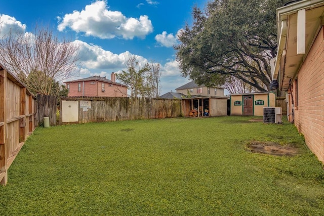 view of yard with central AC and an outdoor structure