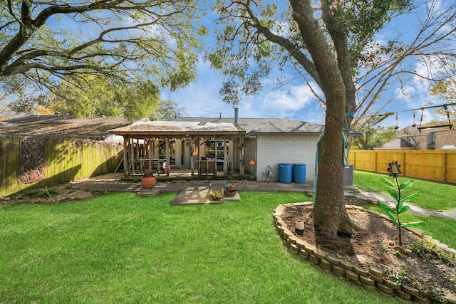 rear view of house with a patio area and a yard