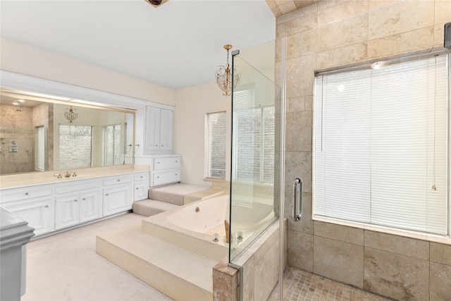 bathroom with shower with separate bathtub and vanity