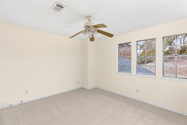 unfurnished room featuring ceiling fan and light colored carpet