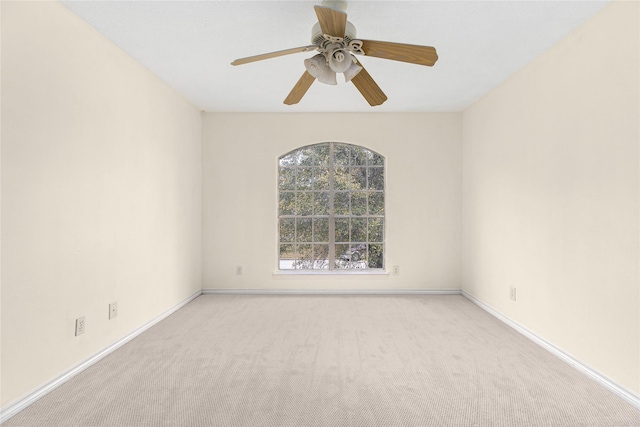 carpeted empty room with ceiling fan