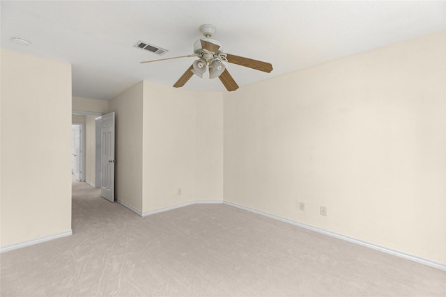 unfurnished room featuring ceiling fan and light colored carpet