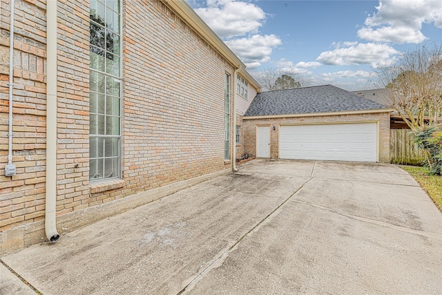 view of property exterior featuring a garage