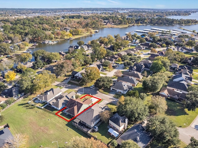 birds eye view of property with a water view