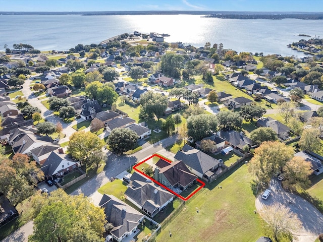 birds eye view of property with a water view