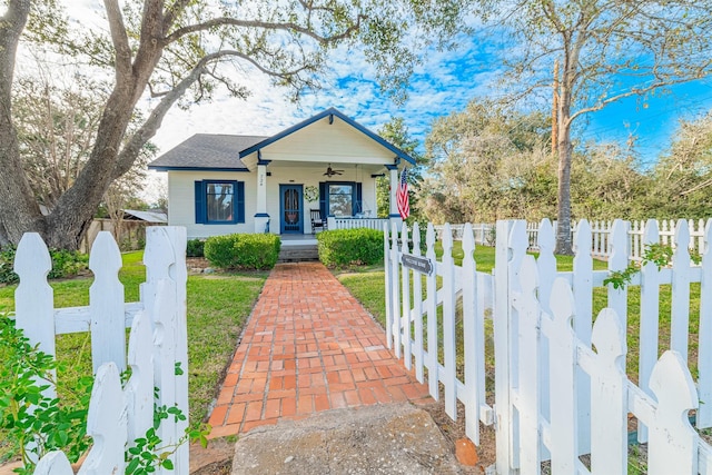 bungalow-style house with covered porch and a front lawn