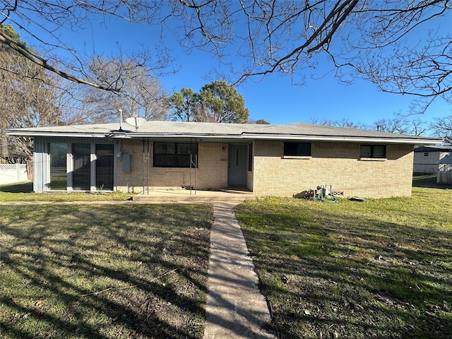 ranch-style home with a patio area and a front yard