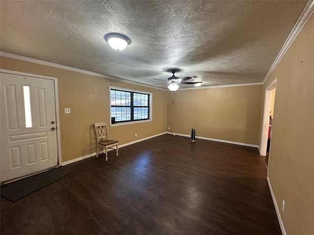 foyer with ceiling fan, dark wood-type flooring, a textured ceiling, and crown molding