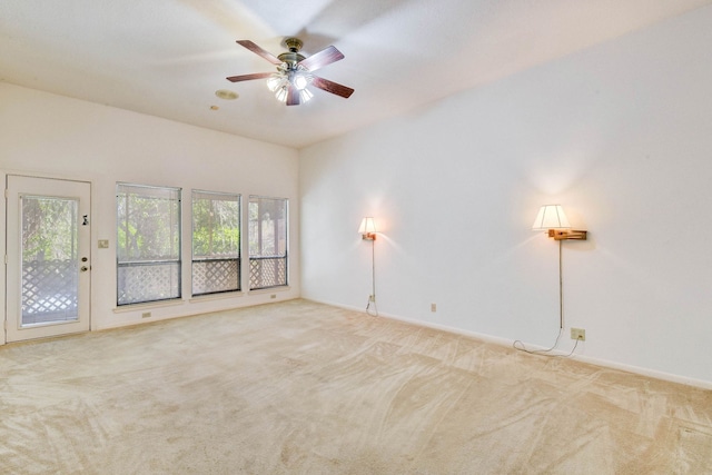 unfurnished room featuring ceiling fan and light carpet