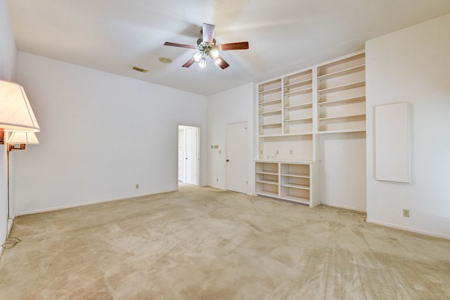 unfurnished bedroom featuring ceiling fan and carpet flooring