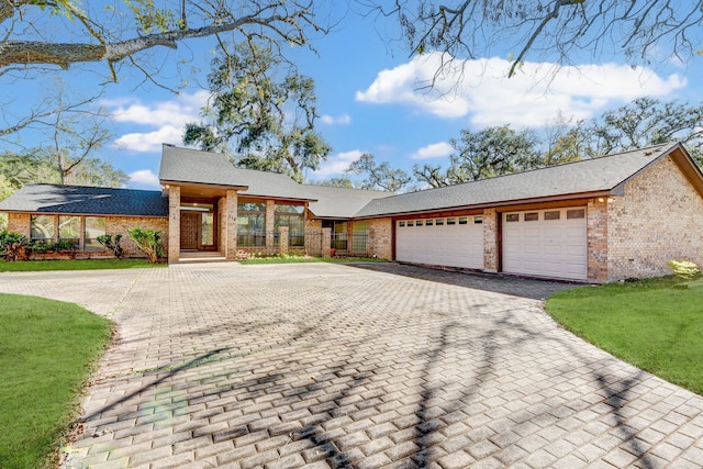 view of front of home with a garage and a front yard