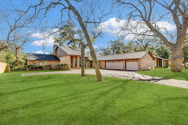 single story home featuring a garage and a front yard