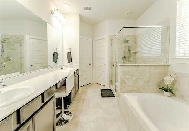 bathroom featuring tile patterned floors, vanity, and independent shower and bath