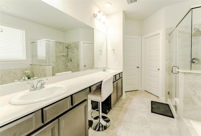 bathroom featuring tile patterned floors, walk in shower, and vanity