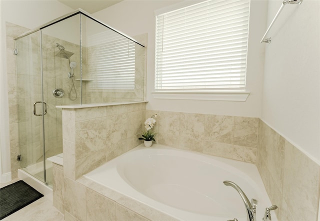 bathroom with shower with separate bathtub