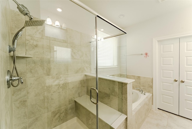 bathroom featuring tile patterned floors and plus walk in shower