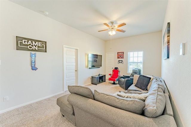 carpeted living room featuring ceiling fan