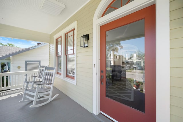property entrance featuring covered porch