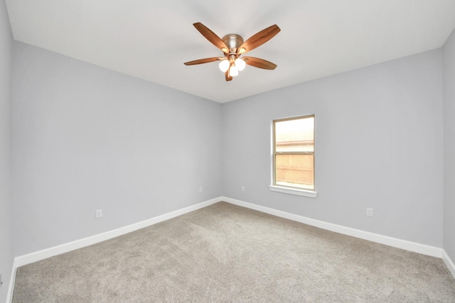 unfurnished room with carpet floors and ceiling fan