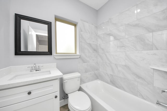 full bathroom featuring shower / bathtub combination, toilet, and vanity