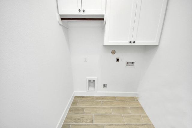 laundry room with hookup for an electric dryer, cabinets, and hookup for a washing machine