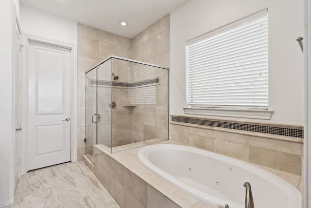 bathroom with shower with separate bathtub