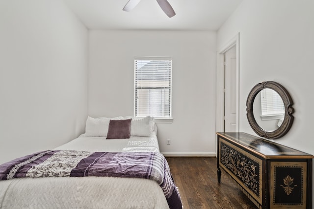 bedroom featuring ceiling fan and dark wood-type flooring