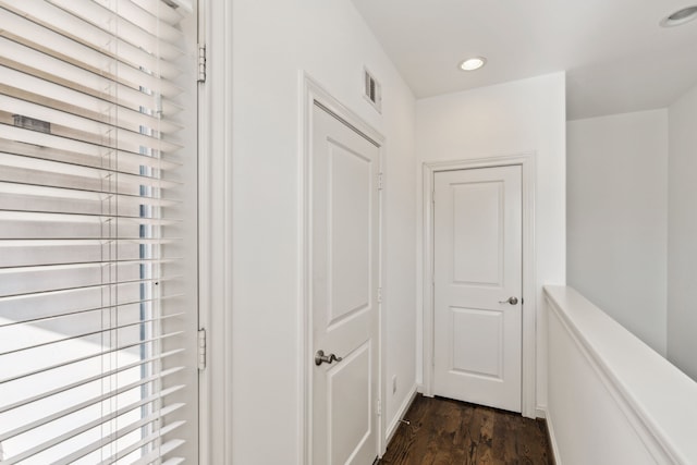 corridor featuring dark wood-type flooring