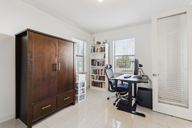 home office featuring a wealth of natural light, ornamental molding, and light tile patterned floors