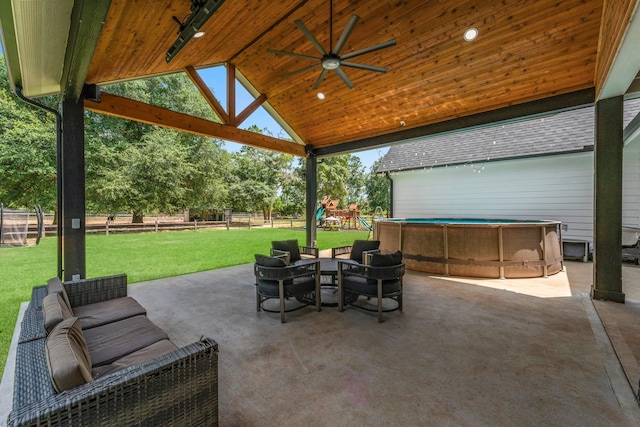 view of patio / terrace with ceiling fan and a playground