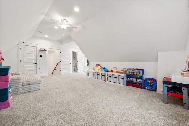 rec room with ceiling fan, carpet, and vaulted ceiling