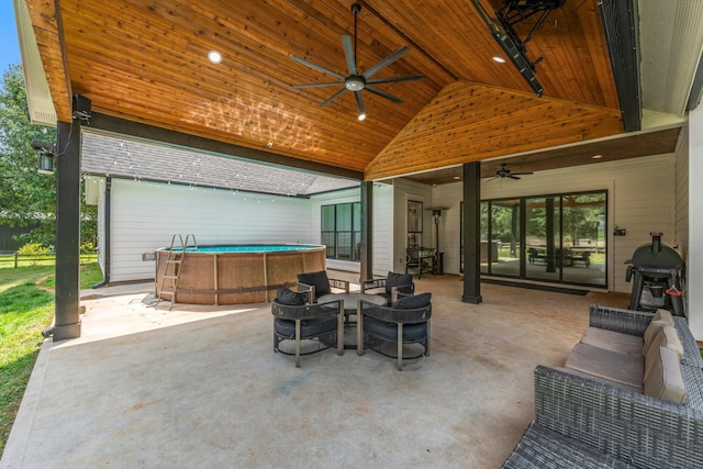 view of patio with grilling area, outdoor lounge area, and ceiling fan