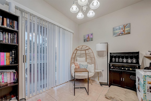 living area featuring light tile patterned flooring and a chandelier