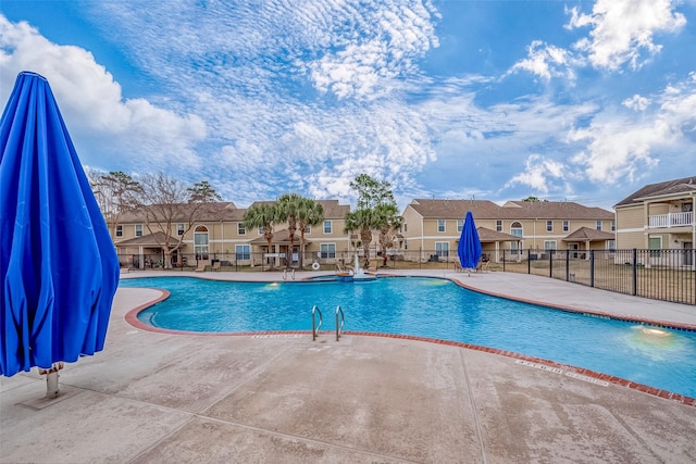 view of swimming pool featuring a patio area