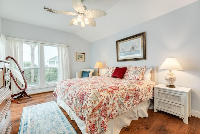 bedroom with vaulted ceiling, ceiling fan, and hardwood / wood-style floors