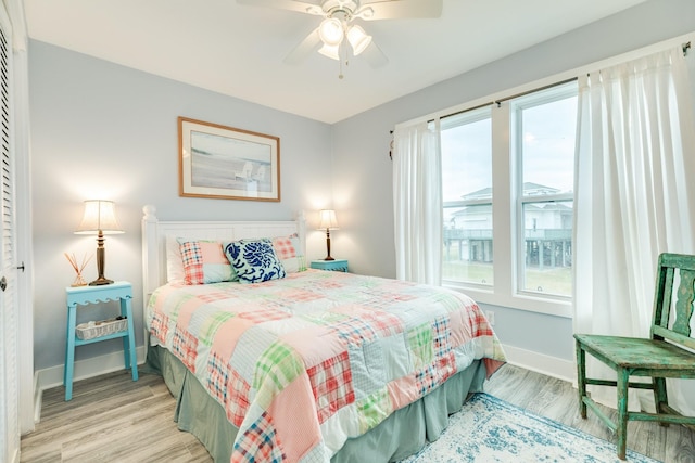 bedroom featuring light hardwood / wood-style floors and ceiling fan