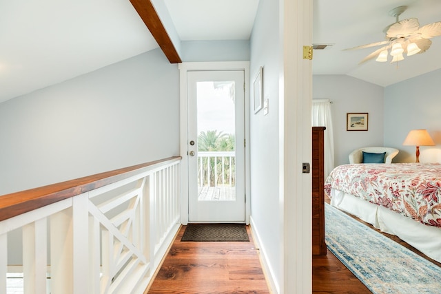 bedroom with ceiling fan, access to exterior, dark hardwood / wood-style flooring, and lofted ceiling with beams