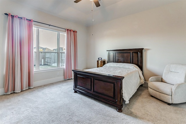 bedroom with light carpet and ceiling fan