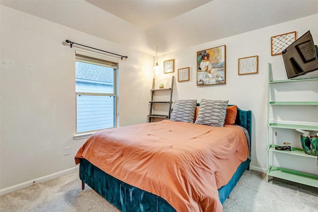 bedroom with light colored carpet