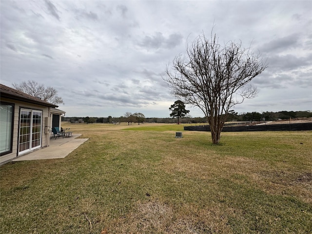 view of yard featuring a patio area and a rural view