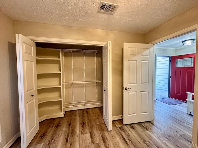 closet featuring visible vents