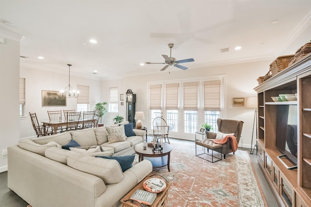 living room with ceiling fan with notable chandelier and ornamental molding