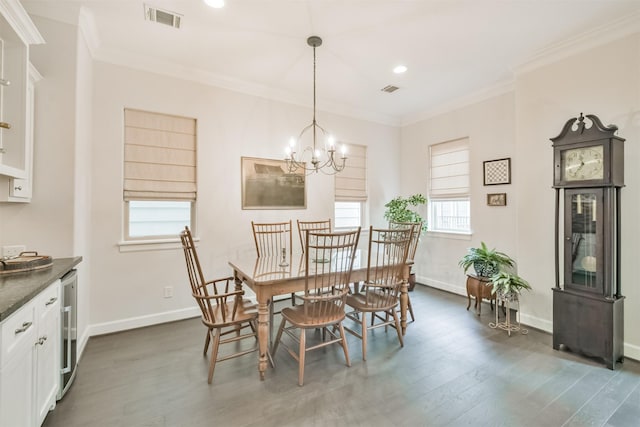 dining area with wine cooler, dark hardwood / wood-style flooring, ornamental molding, and an inviting chandelier