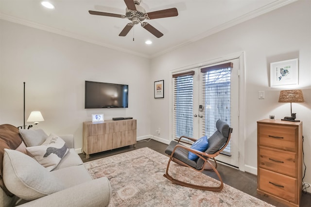 living room featuring ceiling fan, dark wood-type flooring, ornamental molding, and french doors