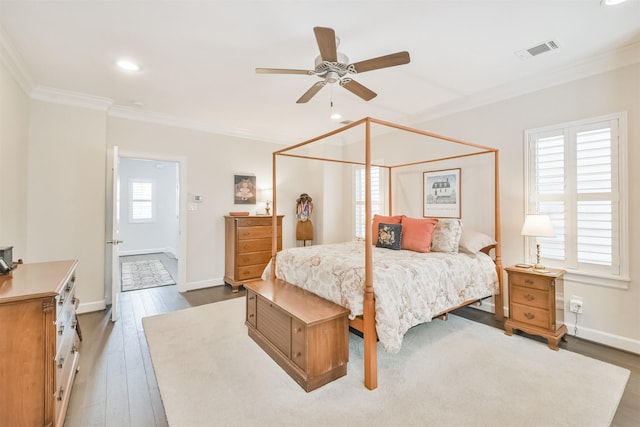 bedroom featuring wood-type flooring, ceiling fan, and ornamental molding