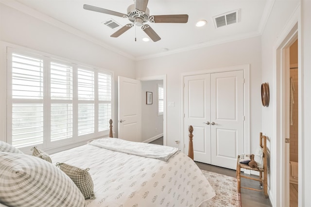 bedroom with ceiling fan, hardwood / wood-style floors, a closet, and ornamental molding