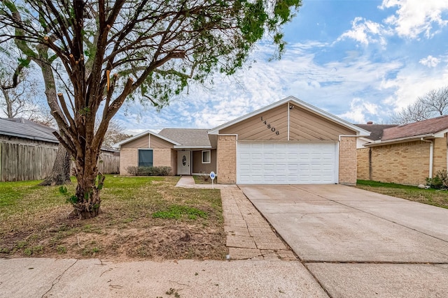 ranch-style home featuring a garage and a front lawn