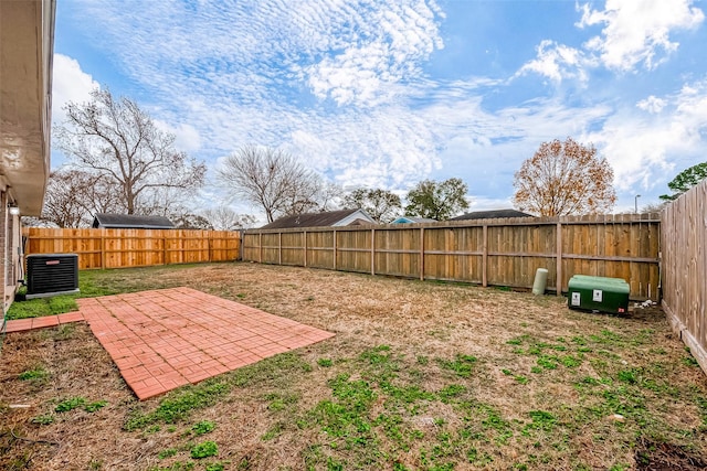 view of yard with a patio area and central air condition unit