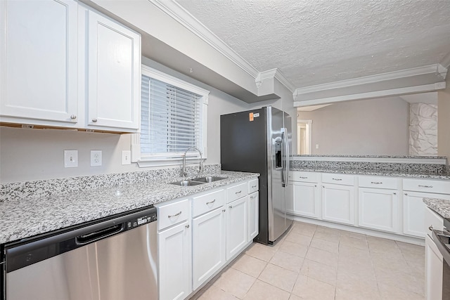 kitchen featuring sink, white cabinets, appliances with stainless steel finishes, and a textured ceiling