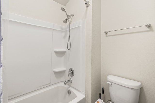 bathroom with shower / bathtub combination and toilet